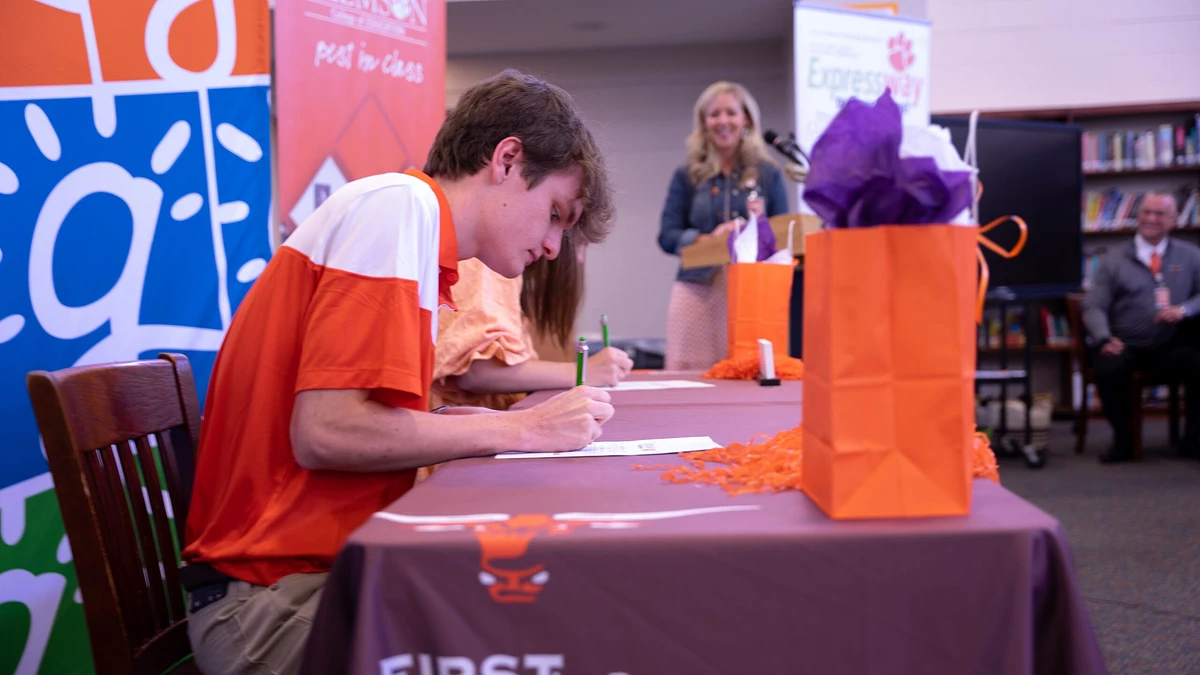 Hunter Wilson and Caroline Wilson officially sign their intention to pursue a degree in education through the Expressway to Tigertown accelerated degree program.